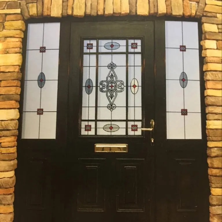 Black front door with Celtic style leaded glass and side panels